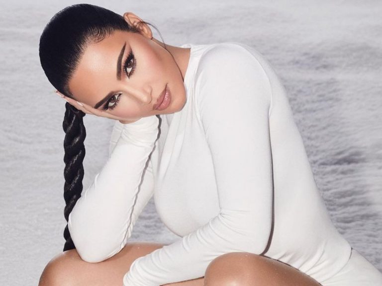 Kim Kardashian Puts Her Curves On Full Display In Two-Piece, Reflective Bathing Suit